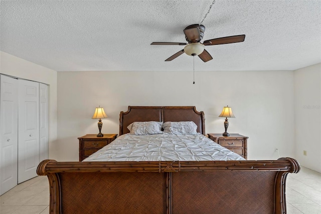 3600 S Ocean Shore Blvd Unit 222, Flagler Beach, FL 32136 - bedroom with light tile patterned floors, a textured ceiling, ceiling fan, and a closet