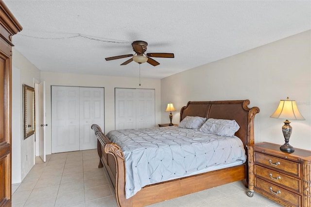 3600 S Ocean Shore Blvd Unit 222, Flagler Beach, FL 32136 - bedroom featuring multiple closets, light tile patterned floors, and ceiling fan