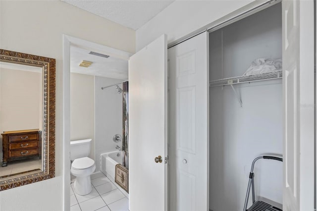 3600 S Ocean Shore Blvd Unit 222, Flagler Beach, FL 32136 - full bathroom featuring toilet, tile patterned flooring, shower / washtub combination, and a closet