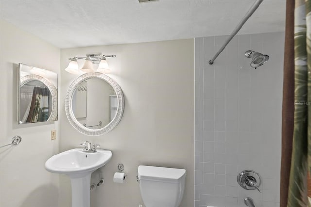 3600 S Ocean Shore Blvd Unit 222, Flagler Beach, FL 32136 - full bathroom featuring shower / bath combination with curtain, toilet, and a sink