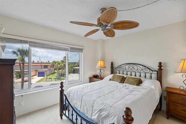 3600 S Ocean Shore Blvd Unit 222, Flagler Beach, FL 32136 - bedroom with a ceiling fan and light tile patterned flooring
