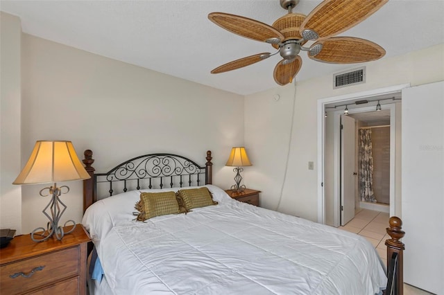 3600 S Ocean Shore Blvd Unit 222, Flagler Beach, FL 32136 - tiled bedroom with ceiling fan and ensuite bathroom