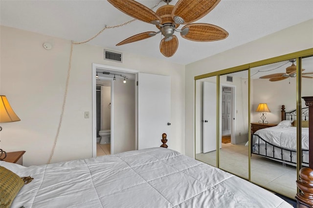 3600 S Ocean Shore Blvd Unit 222, Flagler Beach, FL 32136 - tiled bedroom featuring a closet, ceiling fan, and rail lighting
