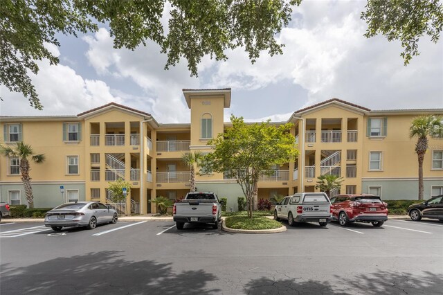 1100 Canopy Walk Ln Unit 1113, Palm Coast, FL 32137 - view of apartment building / complex with uncovered parking