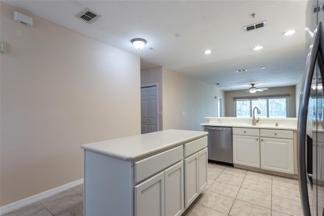 1100 Canopy Walk Ln Unit 1113, Palm Coast, FL 32137 - kitchen featuring stainless steel appliances, a center island, light tile patterned flooring, ceiling fan, and baseboards