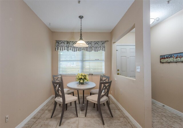 1100 Canopy Walk Ln Unit 1113, Palm Coast, FL 32137 - dining area featuring light tile patterned flooring and baseboards
