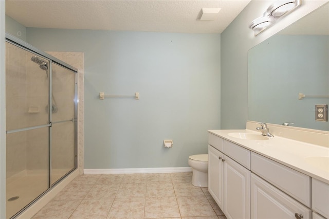 1100 Canopy Walk Ln Unit 1113, Palm Coast, FL 32137 - full bathroom with toilet, double vanity, a shower stall, tile patterned flooring, and baseboards