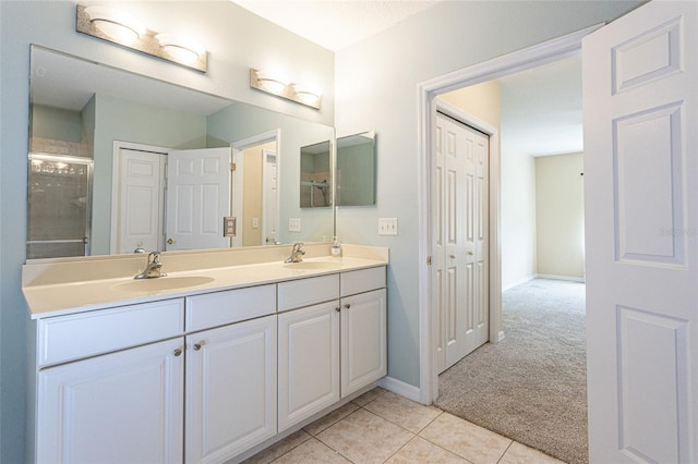 1100 Canopy Walk Ln Unit 1113, Palm Coast, FL 32137 - full bath featuring double vanity, tile patterned flooring, a shower with shower door, and baseboards