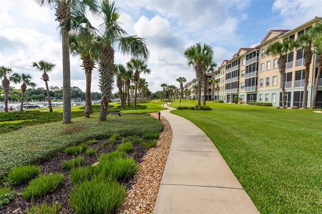 1100 Canopy Walk Ln Unit 1113, Palm Coast, FL 32137 - view of property's community featuring a lawn