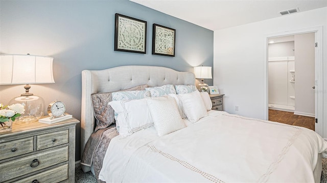 12 Renmont Pl, Palm Coast, FL 32164 - bedroom featuring dark wood-style flooring and connected bathroom