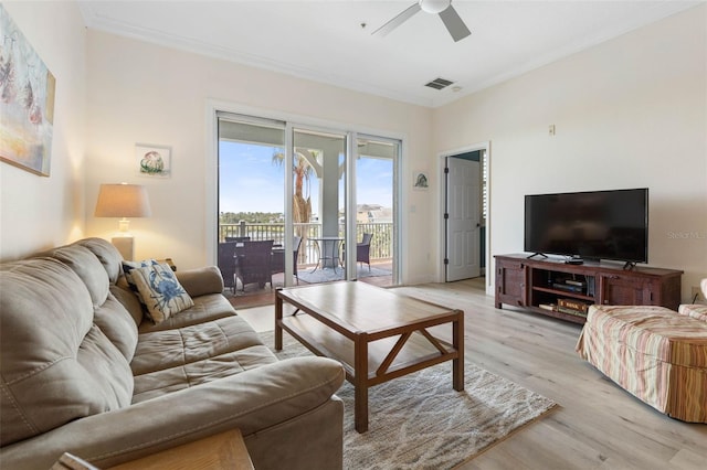 1200 Cinnamon Beach Way Unit 1133, Palm Coast, FL 32137 - living room with a ceiling fan, light wood-style floors, and crown molding