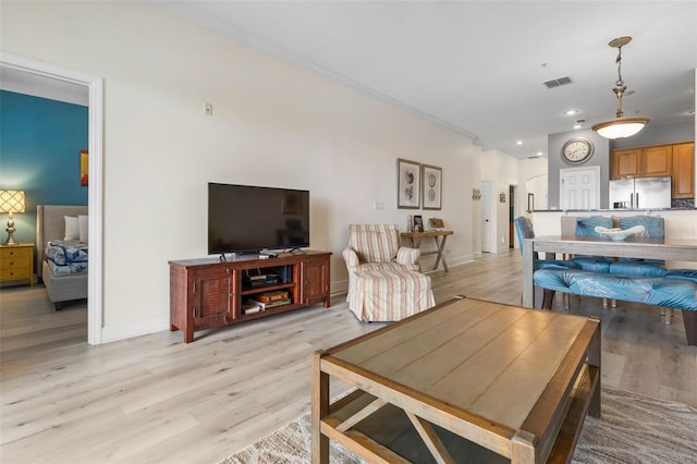 1200 Cinnamon Beach Way Unit 1133, Palm Coast, FL 32137 - living area featuring light wood finished floors, baseboards, and recessed lighting