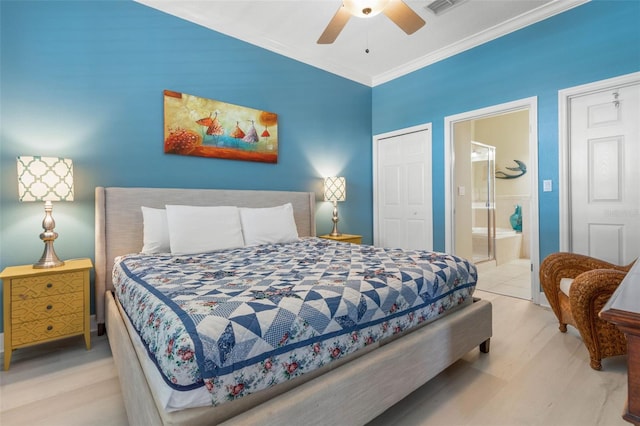 1200 Cinnamon Beach Way Unit 1133, Palm Coast, FL 32137 - bedroom featuring ornamental molding, ensuite bath, ceiling fan, and wood finished floors