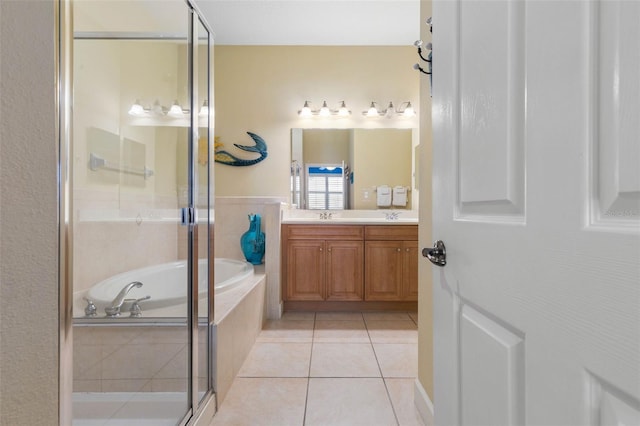 1200 Cinnamon Beach Way Unit 1133, Palm Coast, FL 32137 - bathroom featuring a garden tub, double vanity, a stall shower, and tile patterned floors