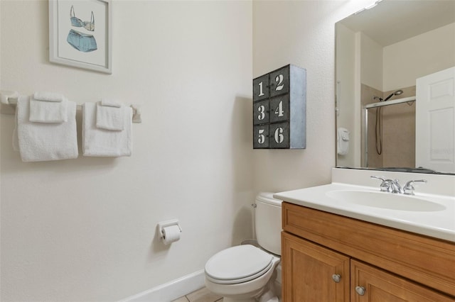 1200 Cinnamon Beach Way Unit 1133, Palm Coast, FL 32137 - bathroom featuring toilet, vanity, an enclosed shower, baseboards, and tile patterned floors