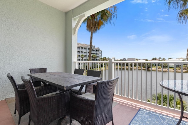 1200 Cinnamon Beach Way Unit 1133, Palm Coast, FL 32137 - balcony featuring a water view and outdoor dining space