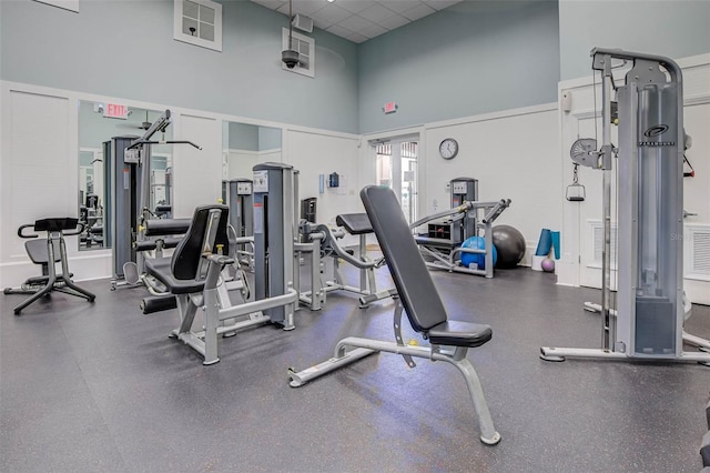 1200 Cinnamon Beach Way Unit 1133, Palm Coast, FL 32137 - workout area with a drop ceiling and a towering ceiling