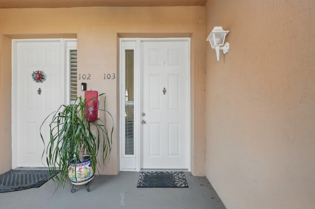 300 Via Castilla Unit 103, Saint Augustine, FL 32095 - view of exterior entry with stucco siding