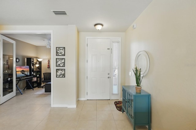 300 Via Castilla Unit 103, Saint Augustine, FL 32095 - entryway featuring light tile patterned floors and baseboards