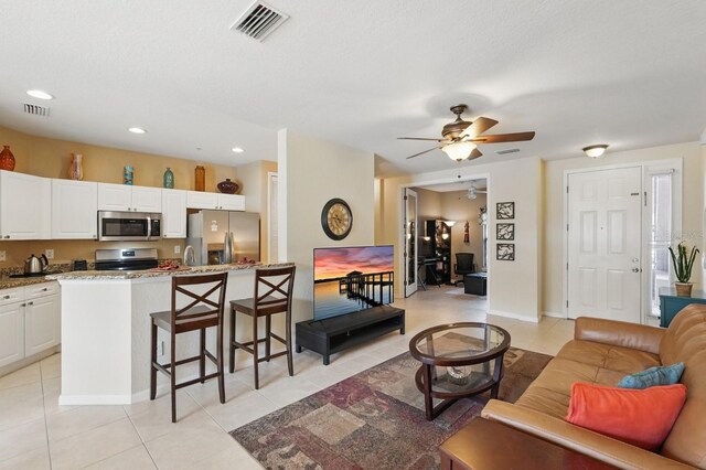 300 Via Castilla Unit 103, Saint Augustine, FL 32095 - living room featuring ceiling fan, light tile patterned floors, recessed lighting, and baseboards