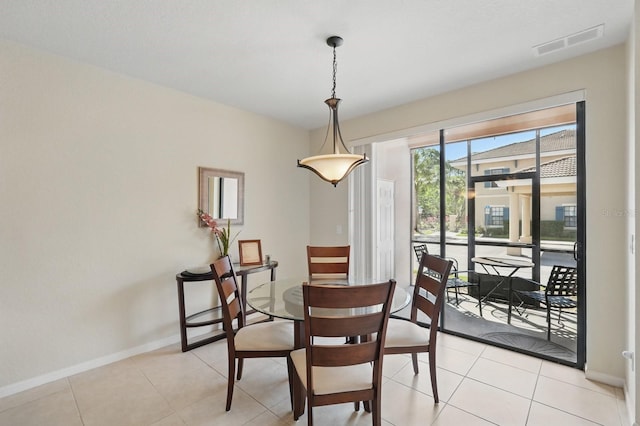 300 Via Castilla Unit 103, Saint Augustine, FL 32095 - dining space with baseboards and light tile patterned floors