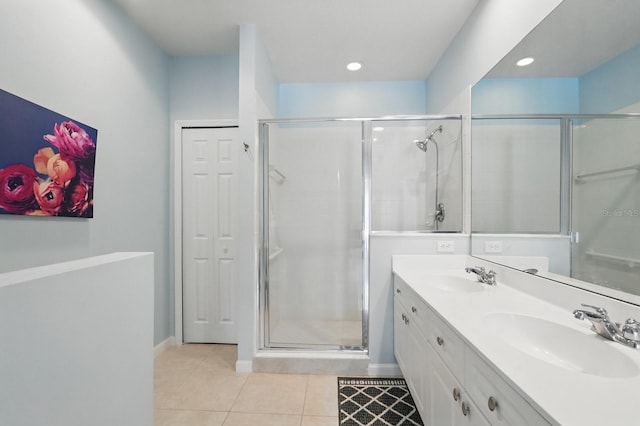 300 Via Castilla Unit 103, Saint Augustine, FL 32095 - full bath featuring double vanity, a stall shower, tile patterned flooring, baseboards, and recessed lighting