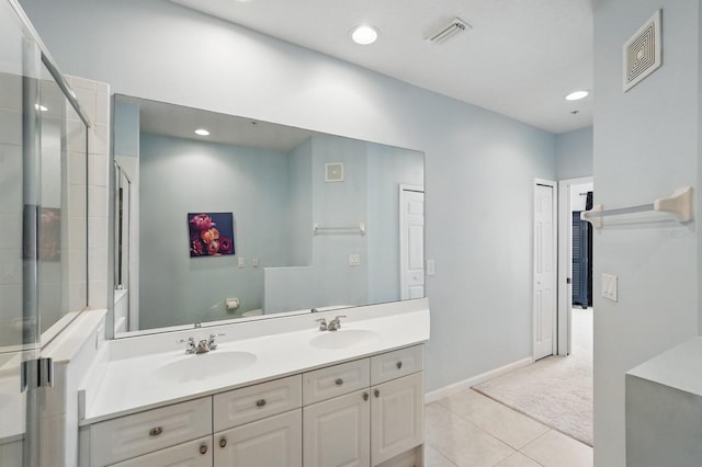 300 Via Castilla Unit 103, Saint Augustine, FL 32095 - full bathroom featuring double vanity, tile patterned flooring, baseboards, recessed lighting, and a tile shower