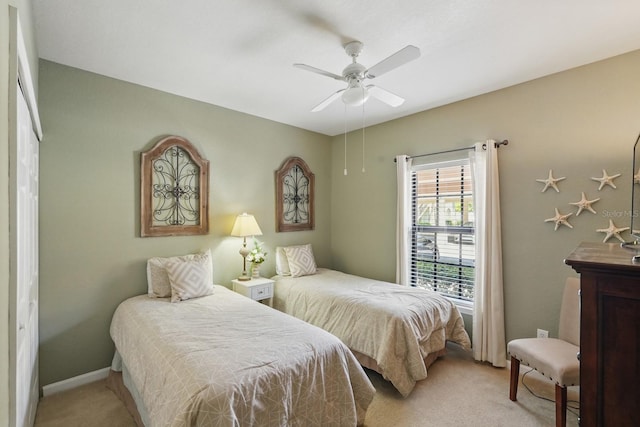 300 Via Castilla Unit 103, Saint Augustine, FL 32095 - bedroom featuring light colored carpet, ceiling fan, and baseboards