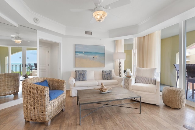 200 Ocean Crest Dr Unit 605, Palm Coast, FL 32137 - living room featuring ceiling fan, hardwood / wood-style flooring, and crown molding