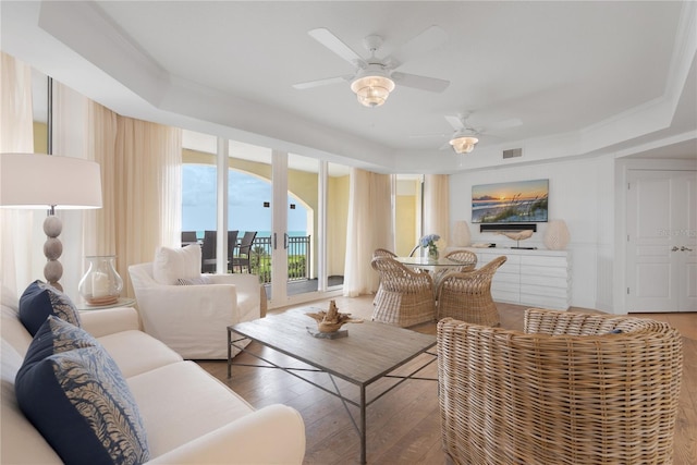 200 Ocean Crest Dr Unit 605, Palm Coast, FL 32137 - living area with wood-type flooring, ceiling fan, and a raised ceiling