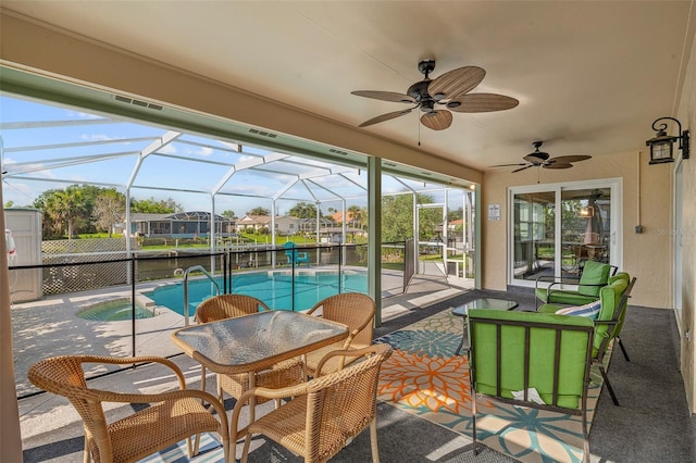 7 Fleming Ct, Palm Coast, FL 32137 - view of patio featuring ceiling fan, an outdoor pool, a water view, and a lanai