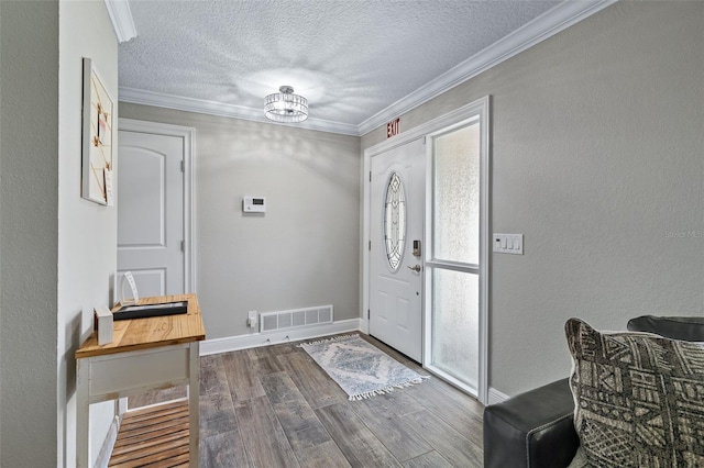 7 Fleming Ct, Palm Coast, FL 32137 - foyer entrance with dark wood-style flooring, a textured ceiling, ornamental molding, plenty of natural light, and baseboards
