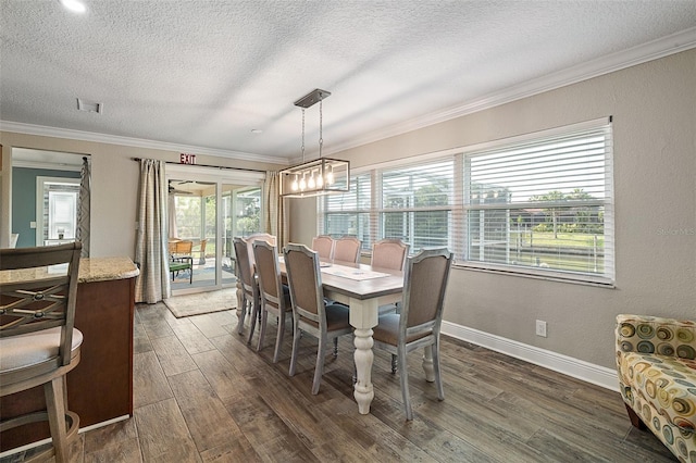 7 Fleming Ct, Palm Coast, FL 32137 - dining room with a textured ceiling, ornamental molding, dark wood-style flooring, and baseboards