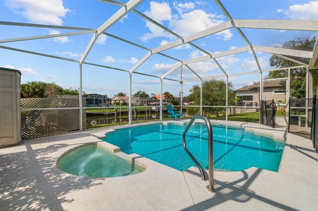 7 Fleming Ct, Palm Coast, FL 32137 - view of swimming pool with a patio area, a pool with connected hot tub, and a lanai