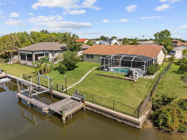 7 Fleming Ct, Palm Coast, FL 32137 - dock featuring a water view, boat lift, glass enclosure, and a residential view