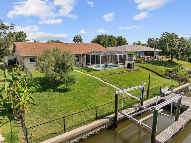 7 Fleming Ct, Palm Coast, FL 32137 - back of house featuring boat lift and glass enclosure
