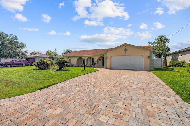 7 Fleming Ct, Palm Coast, FL 32137 - view of front facade with decorative driveway, a front yard, a garage, and stucco siding