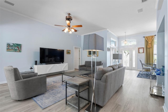 115 Bay Lake Dr, Ormond Beach, FL 32174 - living room with wood finished floors, crown molding, ceiling fan, and baseboards