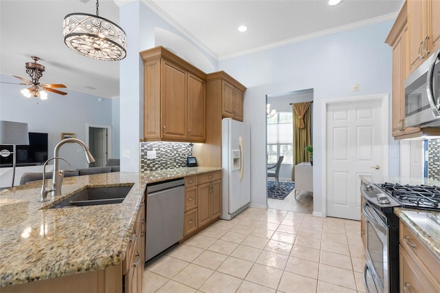 115 Bay Lake Dr, Ormond Beach, FL 32174 - kitchen with appliances with stainless steel finishes, a sink, tasteful backsplash, ceiling fan, and light stone countertops