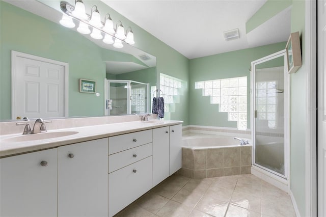 115 Bay Lake Dr, Ormond Beach, FL 32174 - full bath with a shower stall, double vanity, a garden tub, and tile patterned flooring