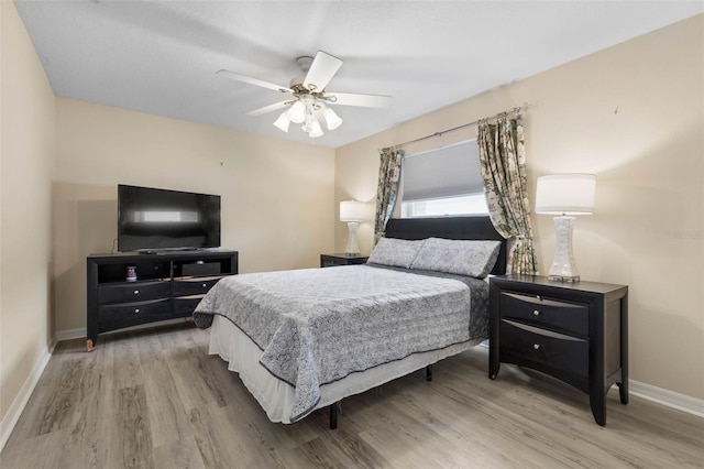 115 Bay Lake Dr, Ormond Beach, FL 32174 - bedroom with wood finished floors, baseboards, and a ceiling fan
