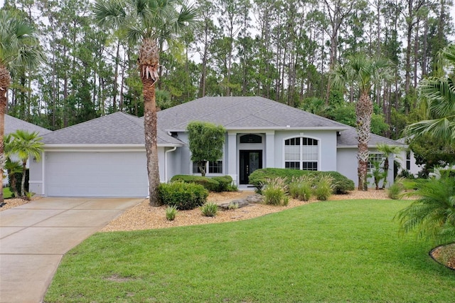 115 Bay Lake Dr, Ormond Beach, FL 32174 - ranch-style home with an attached garage, stucco siding, a front yard, driveway, and roof with shingles