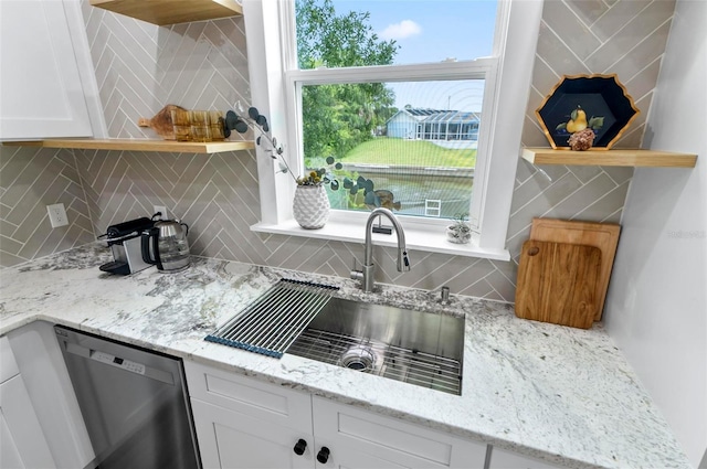 56 Columbia Ln, Palm Coast, FL 32137 - kitchen featuring stainless steel dishwasher, open shelves, and backsplash