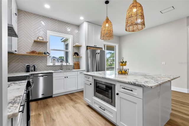 56 Columbia Ln, Palm Coast, FL 32137 - kitchen featuring appliances with stainless steel finishes, open shelves, white cabinets, tasteful backsplash, and recessed lighting