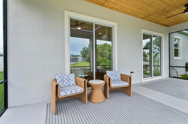 56 Columbia Ln, Palm Coast, FL 32137 - sunroom featuring ceiling fan
