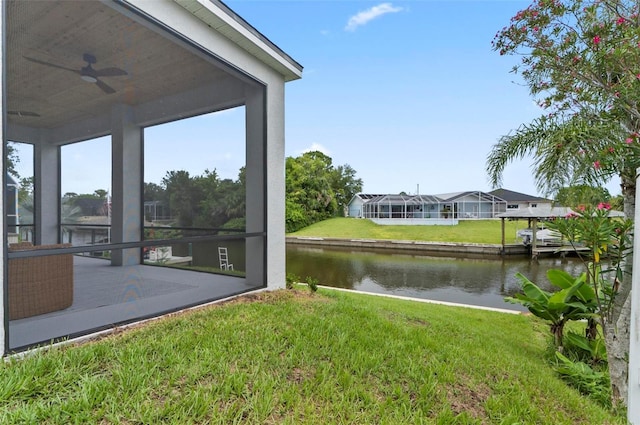 56 Columbia Ln, Palm Coast, FL 32137 - view of grassy yard with a water view and ceiling fan