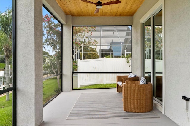 56 Columbia Ln, Palm Coast, FL 32137 - sunroom featuring a ceiling fan