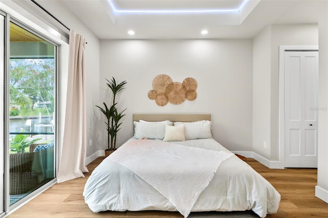 56 Columbia Ln, Palm Coast, FL 32137 - bedroom featuring access to outside, recessed lighting, and wood finished floors