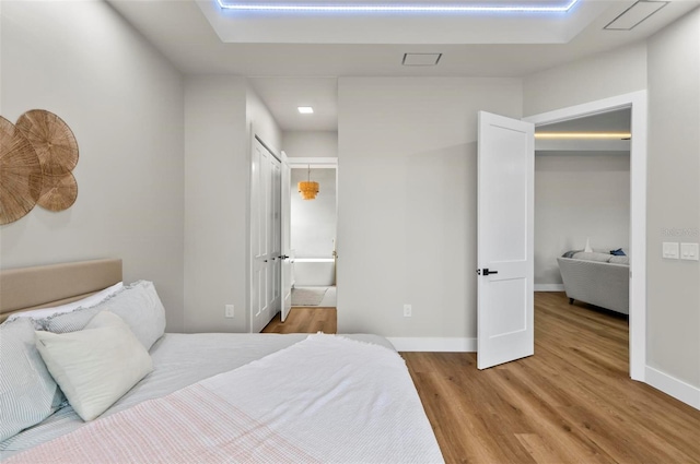 56 Columbia Ln, Palm Coast, FL 32137 - bedroom with wood finished floors and ensuite bath