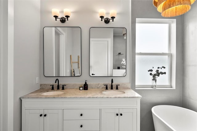 56 Columbia Ln, Palm Coast, FL 32137 - bathroom featuring a freestanding bath and double vanity
